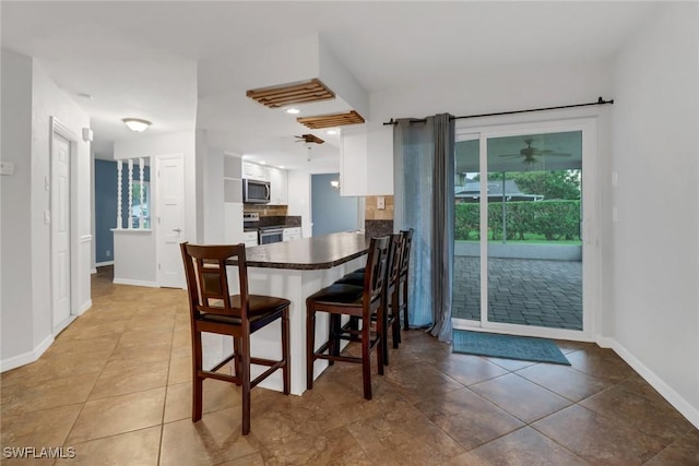 dining room with tile patterned flooring