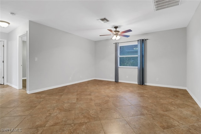 unfurnished room with ceiling fan