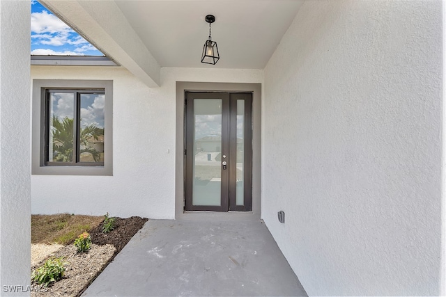 doorway to property featuring french doors