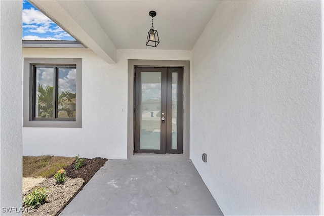 516 Kilarney Ave S, Lehigh Acres, FL 33974 - doorway to property featuring stucco siding
