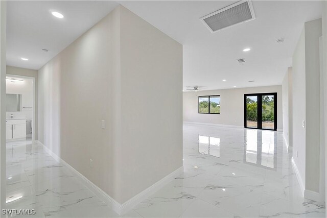 516 Kilarney Ave S, Lehigh Acres, FL 33974 - hallway featuring visible vents, recessed lighting, marble finish floor, and baseboards