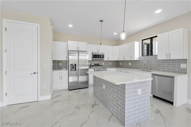 516 Kilarney Ave S, Lehigh Acres, FL 33974 - kitchen featuring recessed lighting, white cabinets, a sink, appliances with stainless steel finishes, and backsplash