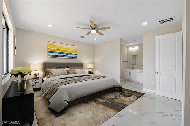 bedroom featuring sink, ensuite bathroom, and ceiling fan