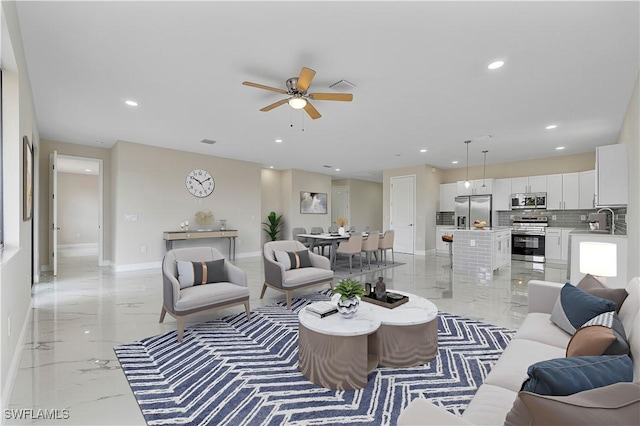 516 Kilarney Ave S, Lehigh Acres, FL 33974 - living room featuring visible vents, marble finish floor, baseboards, recessed lighting, and a ceiling fan