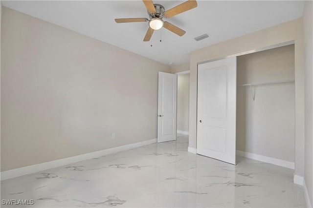 516 Kilarney Ave S, Lehigh Acres, FL 33974 - unfurnished bedroom with baseboards, a closet, marble finish floor, and visible vents