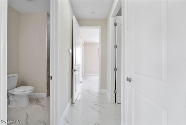 516 Kilarney Ave S, Lehigh Acres, FL 33974 - bathroom with baseboards, toilet, and marble finish floor