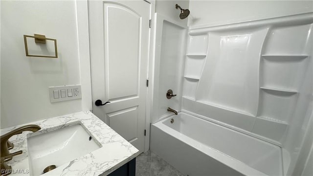 bathroom with vanity and washtub / shower combination