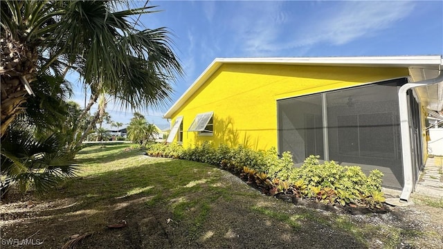 view of home's exterior featuring a lawn