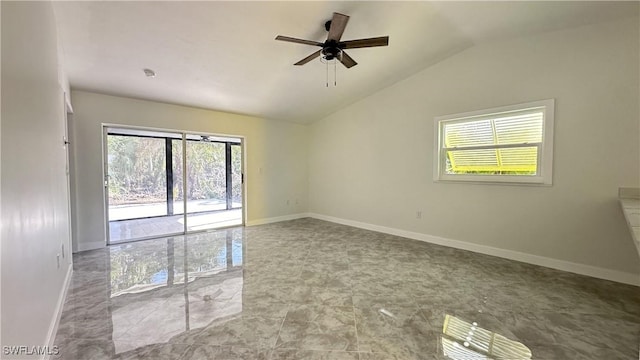 spare room featuring ceiling fan and lofted ceiling