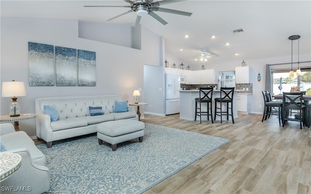 1013 SW 4th Pl, Cape Coral, FL 33991 - living area with ceiling fan, light wood-style floors, recessed lighting, baseboards, and high vaulted ceiling