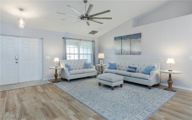 1013 SW 4th Pl, Cape Coral, FL 33991 - living area featuring ceiling fan, vaulted ceiling, baseboards, and wood finished floors