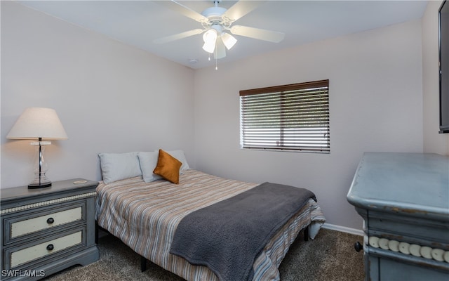 bedroom with ceiling fan and dark carpet