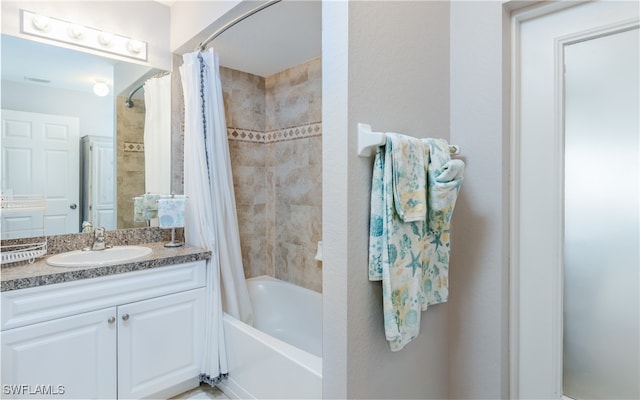 bathroom featuring shower / tub combo with curtain and vanity