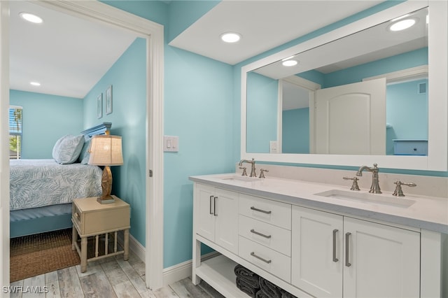 bathroom featuring vanity and hardwood / wood-style floors