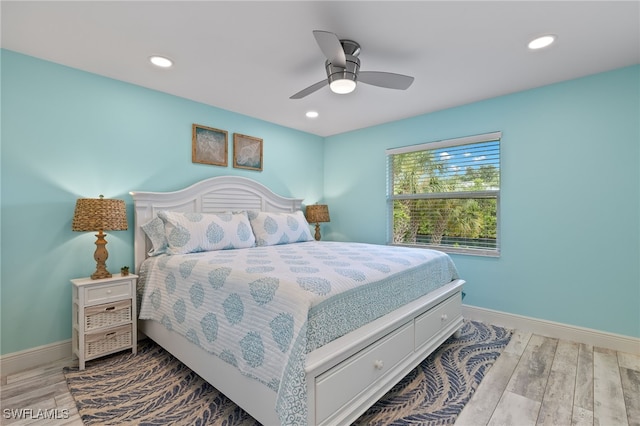 bedroom featuring recessed lighting, ceiling fan, baseboards, and wood finished floors