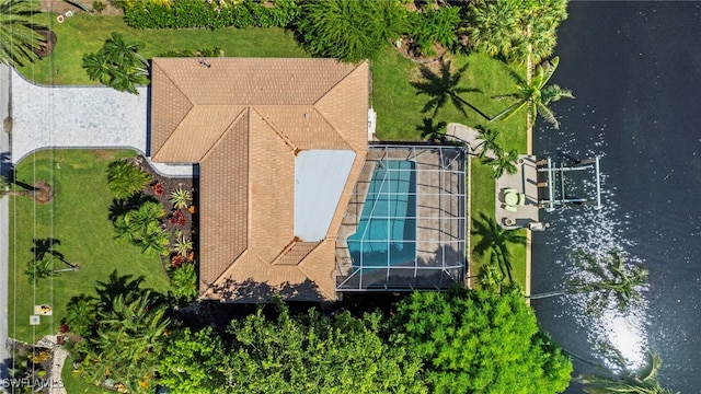 birds eye view of property with a water view