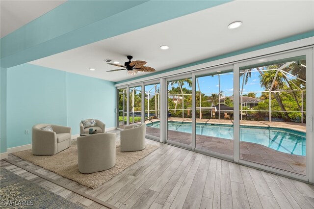 view of swimming pool featuring ceiling fan