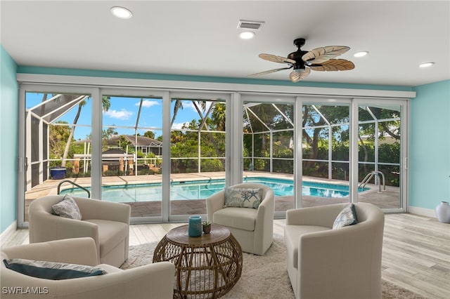 interior space with a swimming pool, visible vents, and ceiling fan
