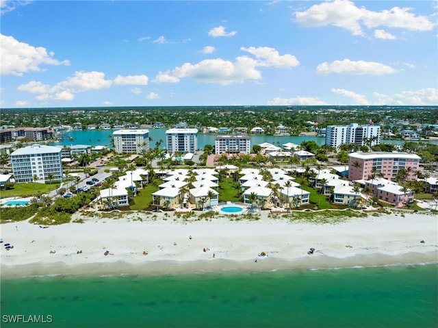 bird's eye view with a water view and a view of the beach