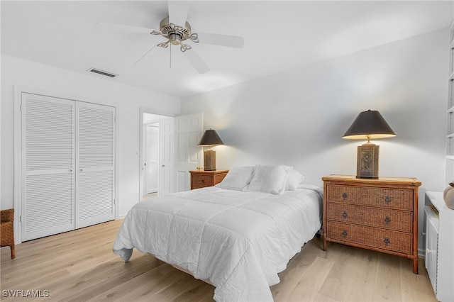 bedroom featuring a closet, ceiling fan, and light hardwood / wood-style flooring