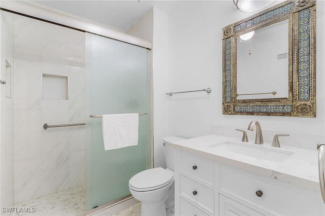 bathroom with toilet, walk in shower, and vanity