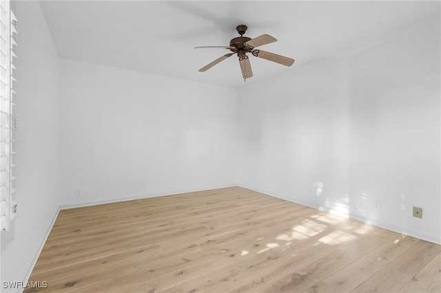 unfurnished room with ceiling fan and light hardwood / wood-style flooring