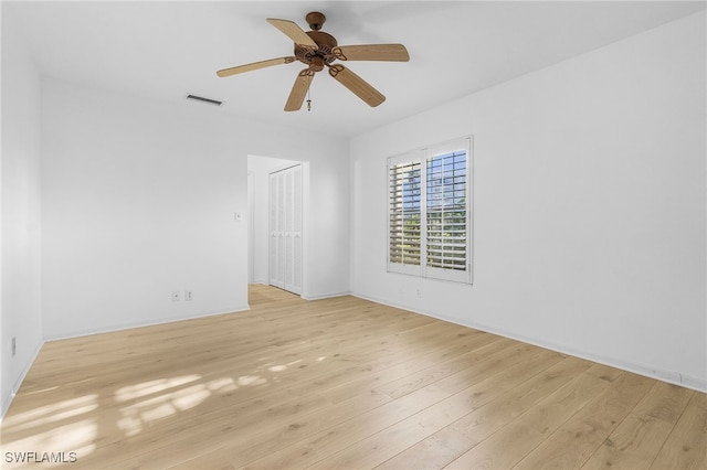 unfurnished room featuring ceiling fan and light wood-type flooring