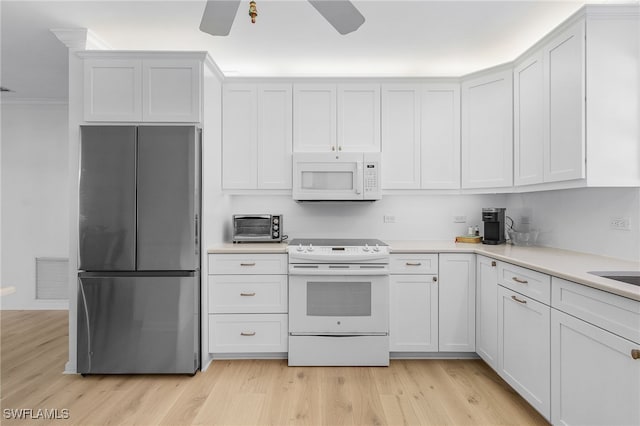 kitchen with ceiling fan, white cabinetry, white appliances, and light hardwood / wood-style floors