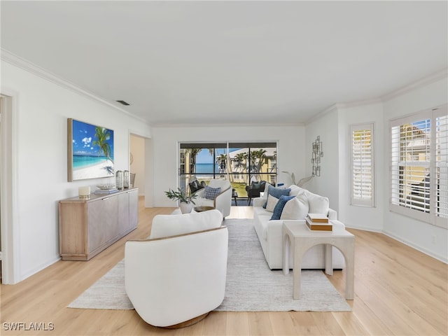 2601 Gulf Shore Blvd N Unit 34, Naples, FL 34103 - living area with crown molding and light wood-style flooring