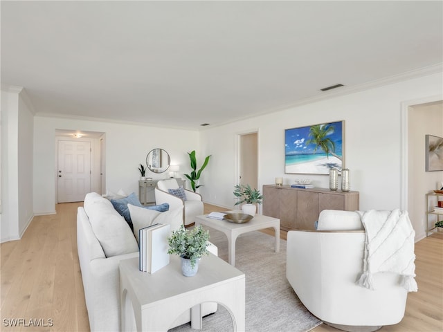 2601 Gulf Shore Blvd N Unit 34, Naples, FL 34103 - living area featuring crown molding and light wood finished floors
