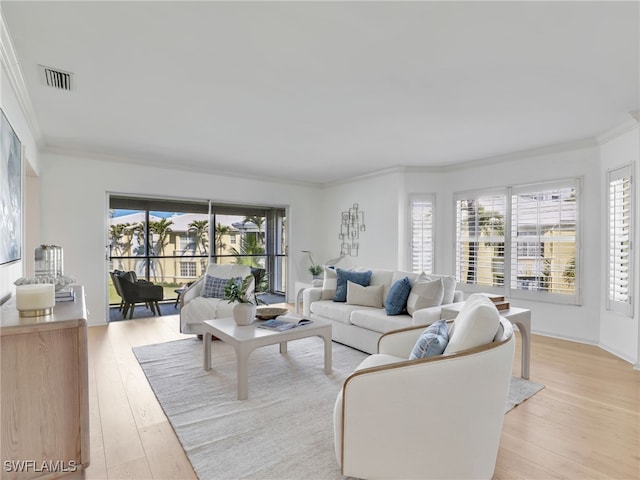2601 Gulf Shore Blvd N Unit 34, Naples, FL 34103 - living room with crown molding and light wood finished floors
