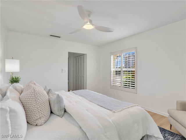 2601 Gulf Shore Blvd N Unit 34, Naples, FL 34103 - bedroom with light wood-style flooring and a ceiling fan