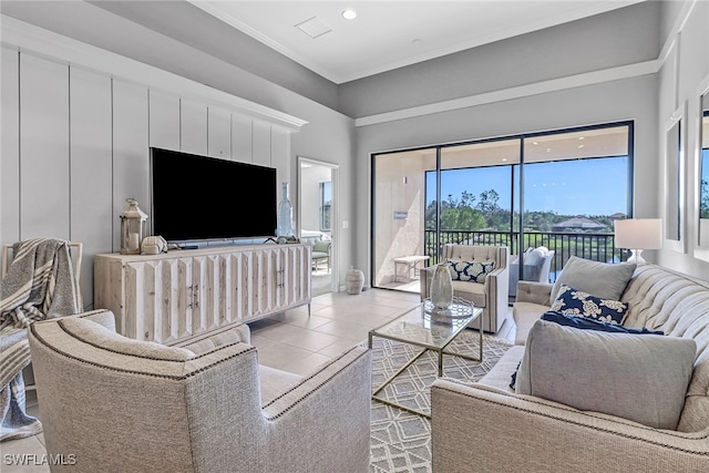 living room with ornamental molding and light tile patterned floors