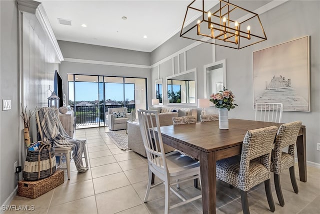 tiled dining area featuring a chandelier