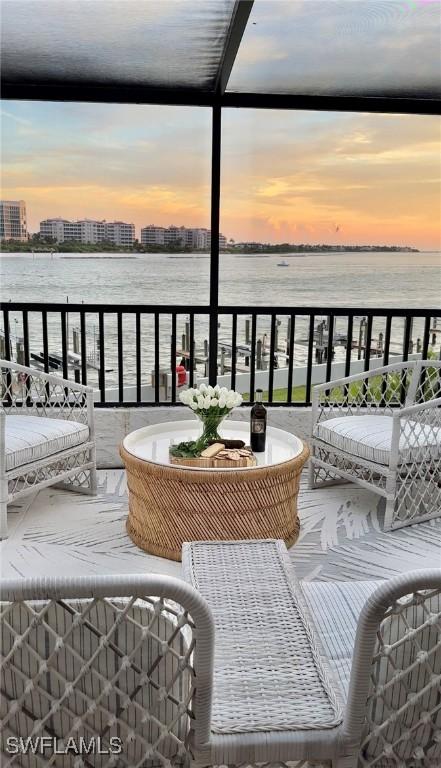 balcony at dusk with a water view