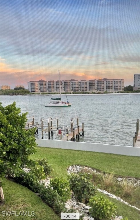 exterior space featuring a water view and a yard