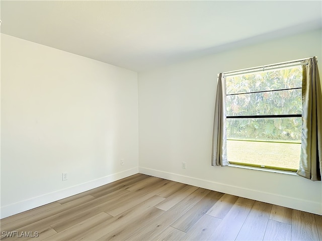 unfurnished room with light hardwood / wood-style floors