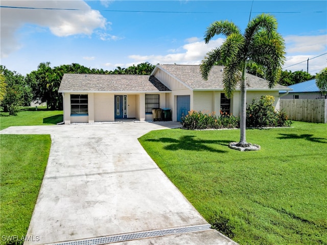 ranch-style home featuring a front lawn