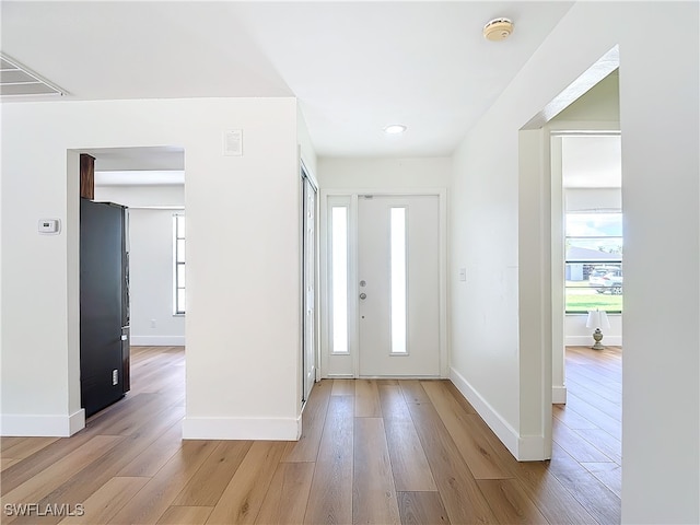 entryway with light hardwood / wood-style floors