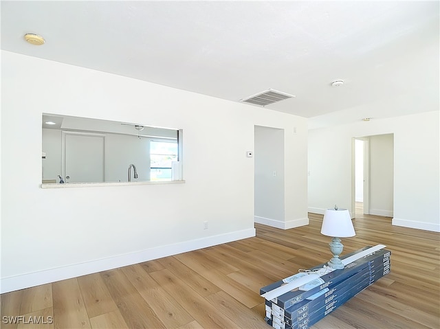 unfurnished living room featuring hardwood / wood-style flooring