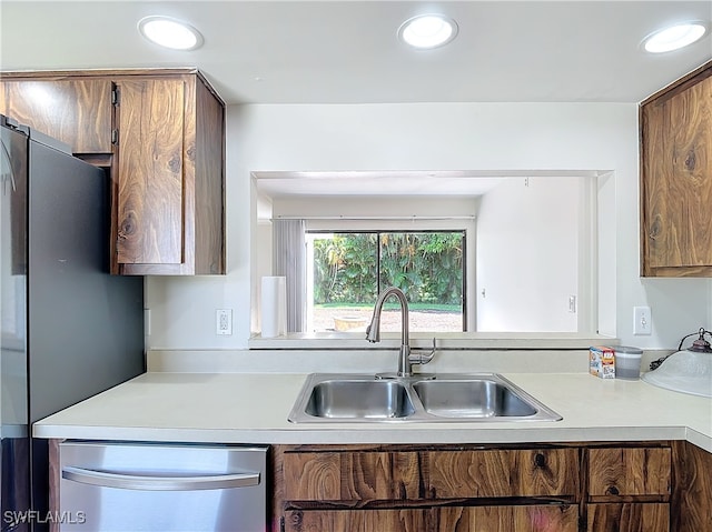 kitchen with sink and appliances with stainless steel finishes