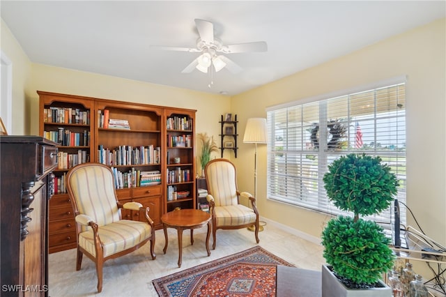 living area with ceiling fan