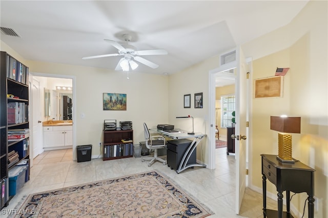 tiled office space with ceiling fan