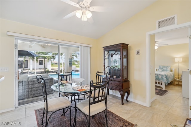 dining area featuring light tile patterned floors, vaulted ceiling, and ceiling fan