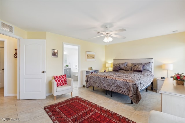 tiled bedroom featuring ceiling fan and ensuite bathroom