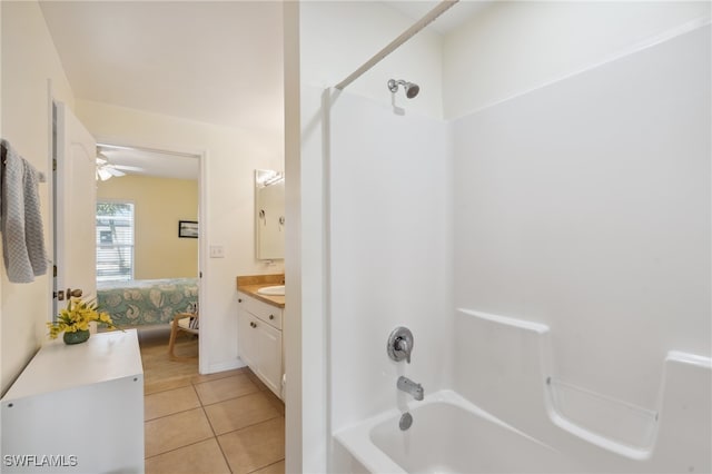 bathroom with ceiling fan, shower / bathing tub combination, vanity, and tile patterned floors