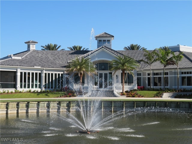 back of house featuring a water view