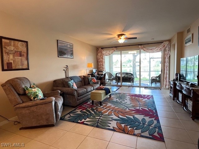 tiled living room with ceiling fan