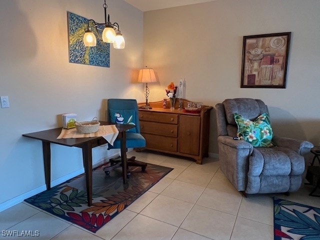 home office featuring an inviting chandelier and light tile patterned floors