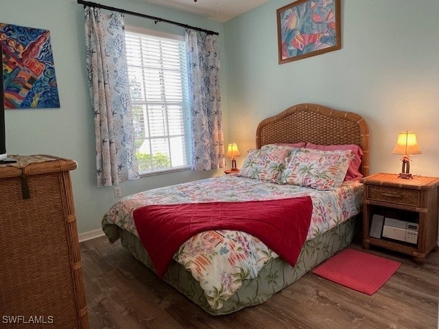 bedroom featuring dark hardwood / wood-style flooring